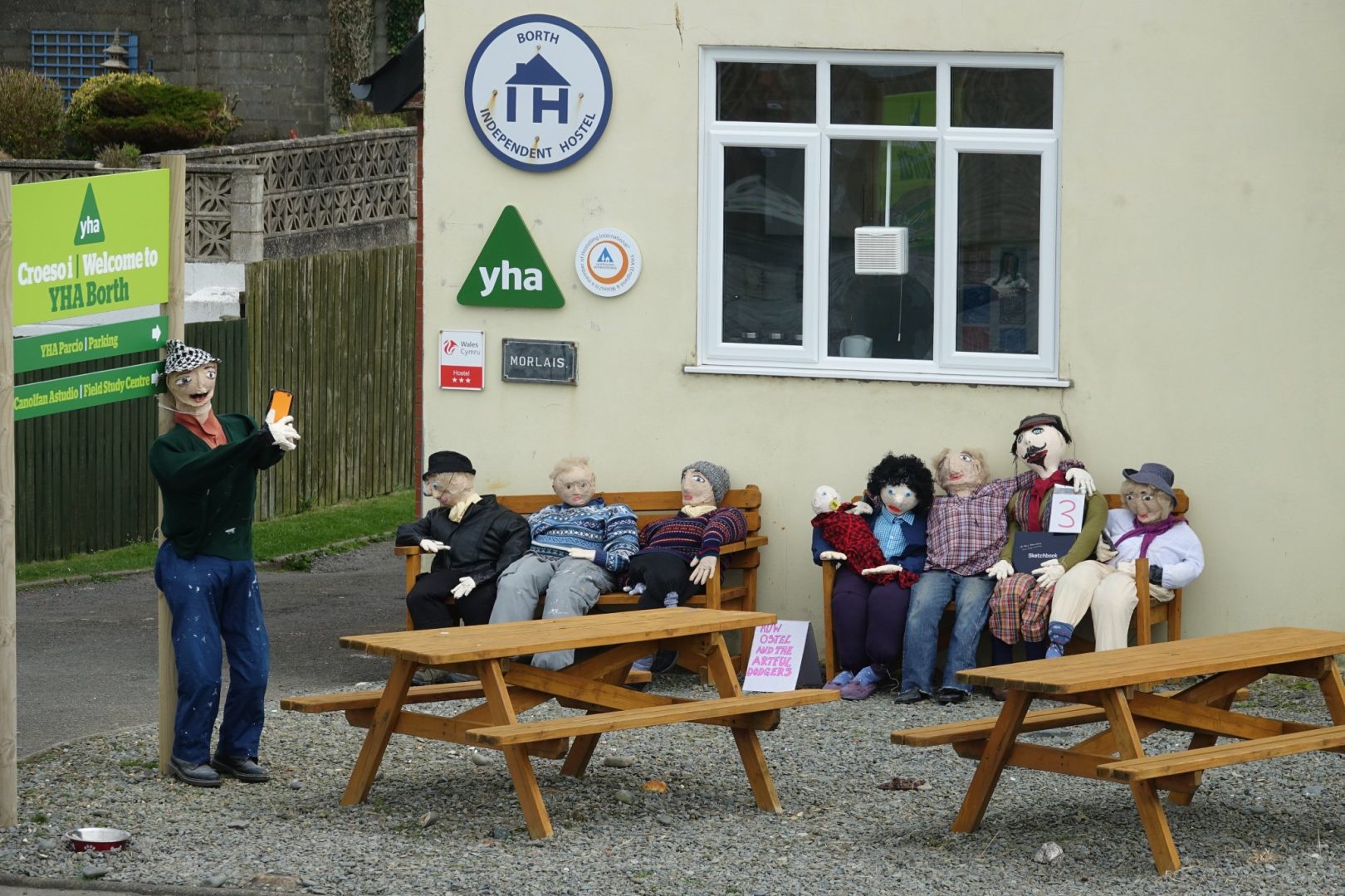 Scarecows sitting outside Borth Youth HOste