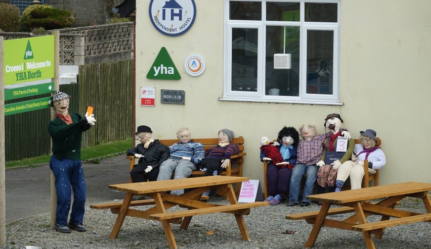 Scarecows sitting outside Borth Youth HOste