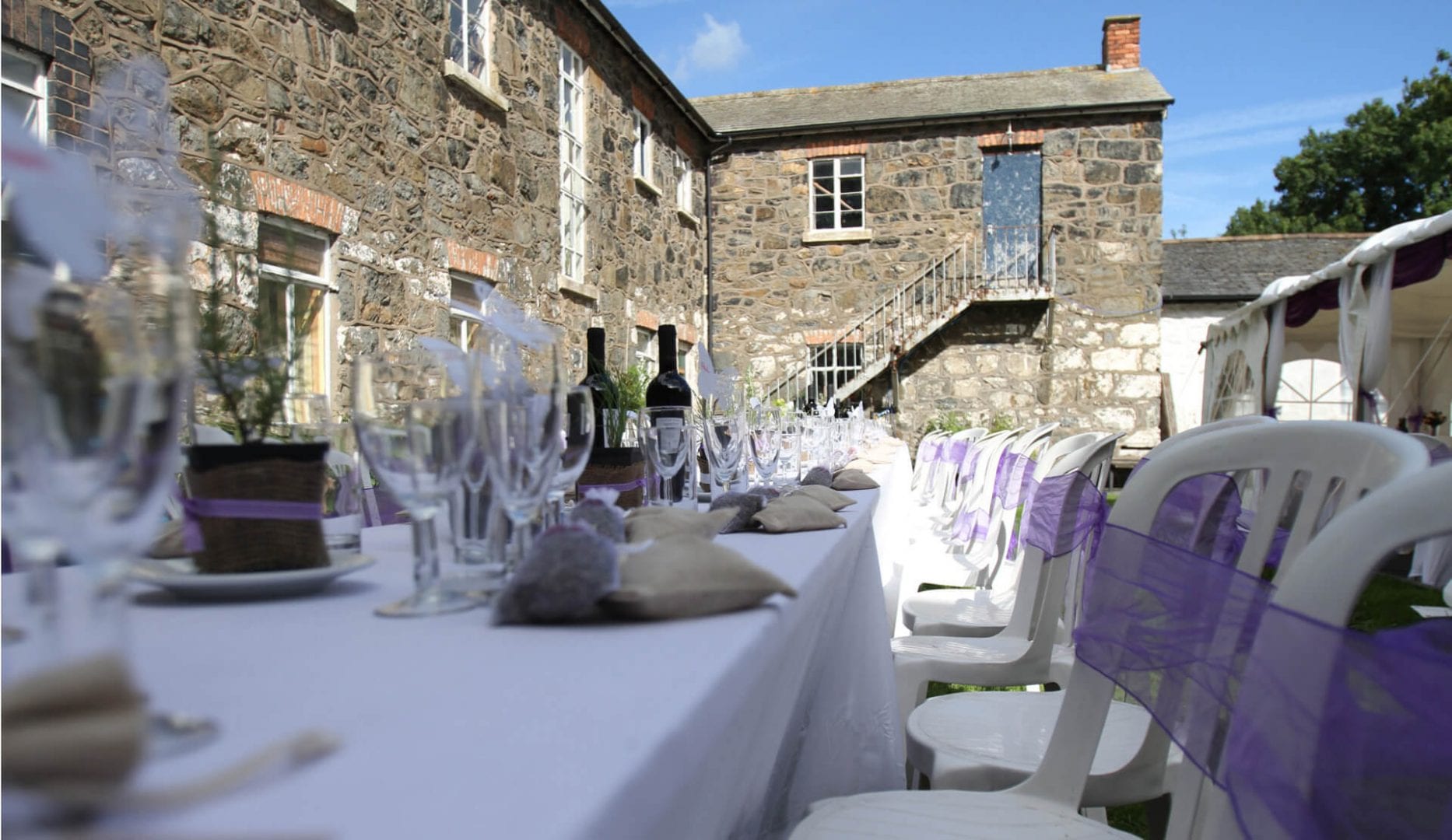 tables set for a wedding at bunkhouse at the workhouse