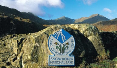 snowdonia national park sign in landscape around Rhy Du and the slate trail