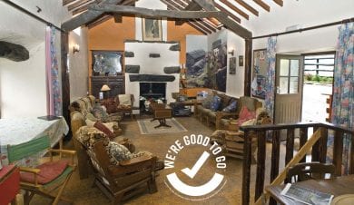 inside of Conwy Valley Backpackers Barn with VisitWales Good to Go certification badge