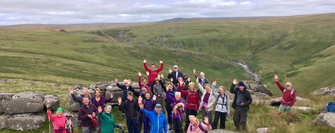 A large group of waving walkers on Dartmoor