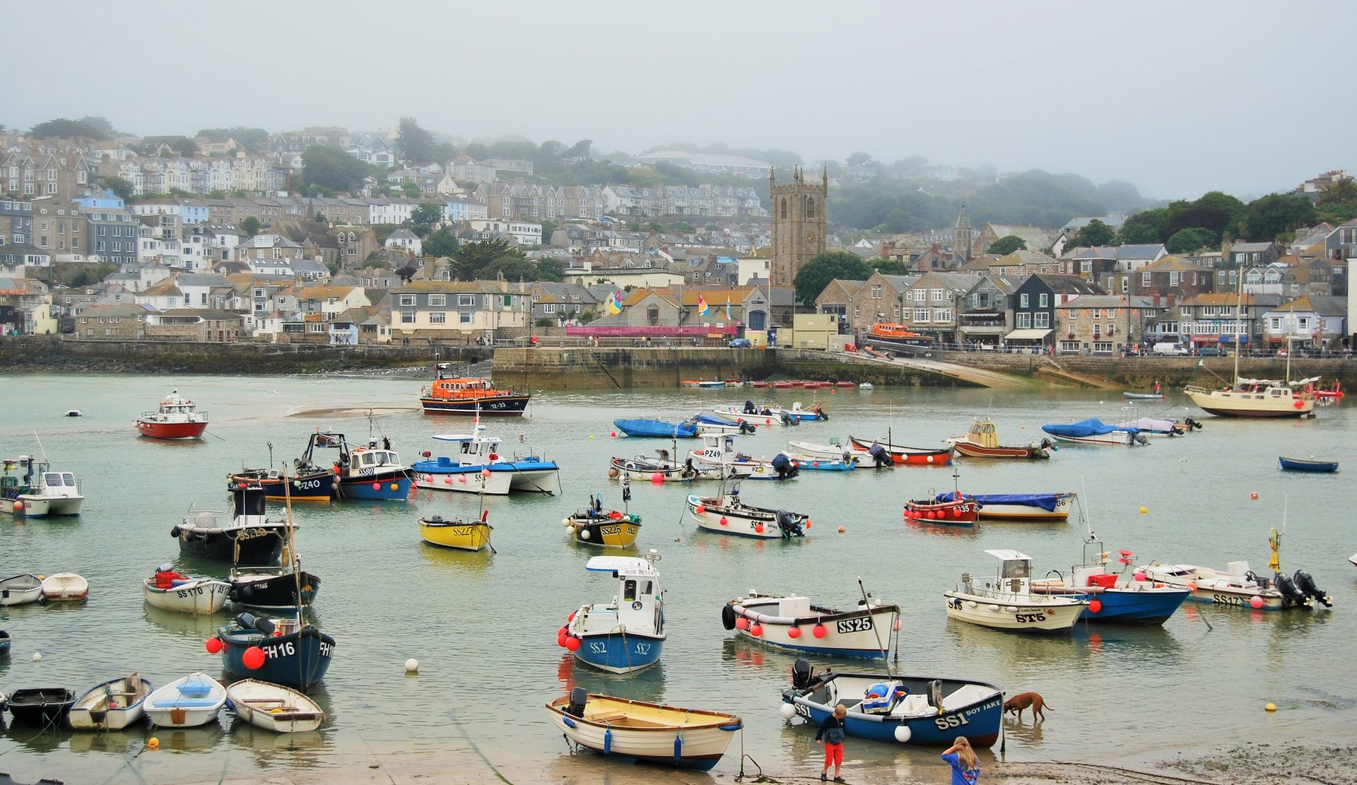 A misty day in St Ives bay. Filled with colourful boats 