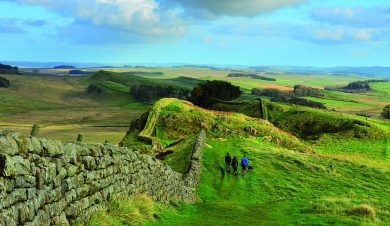 Beautiful scenic walking along Hadrian's Wall following the wall over peaks and troughs of the landscape