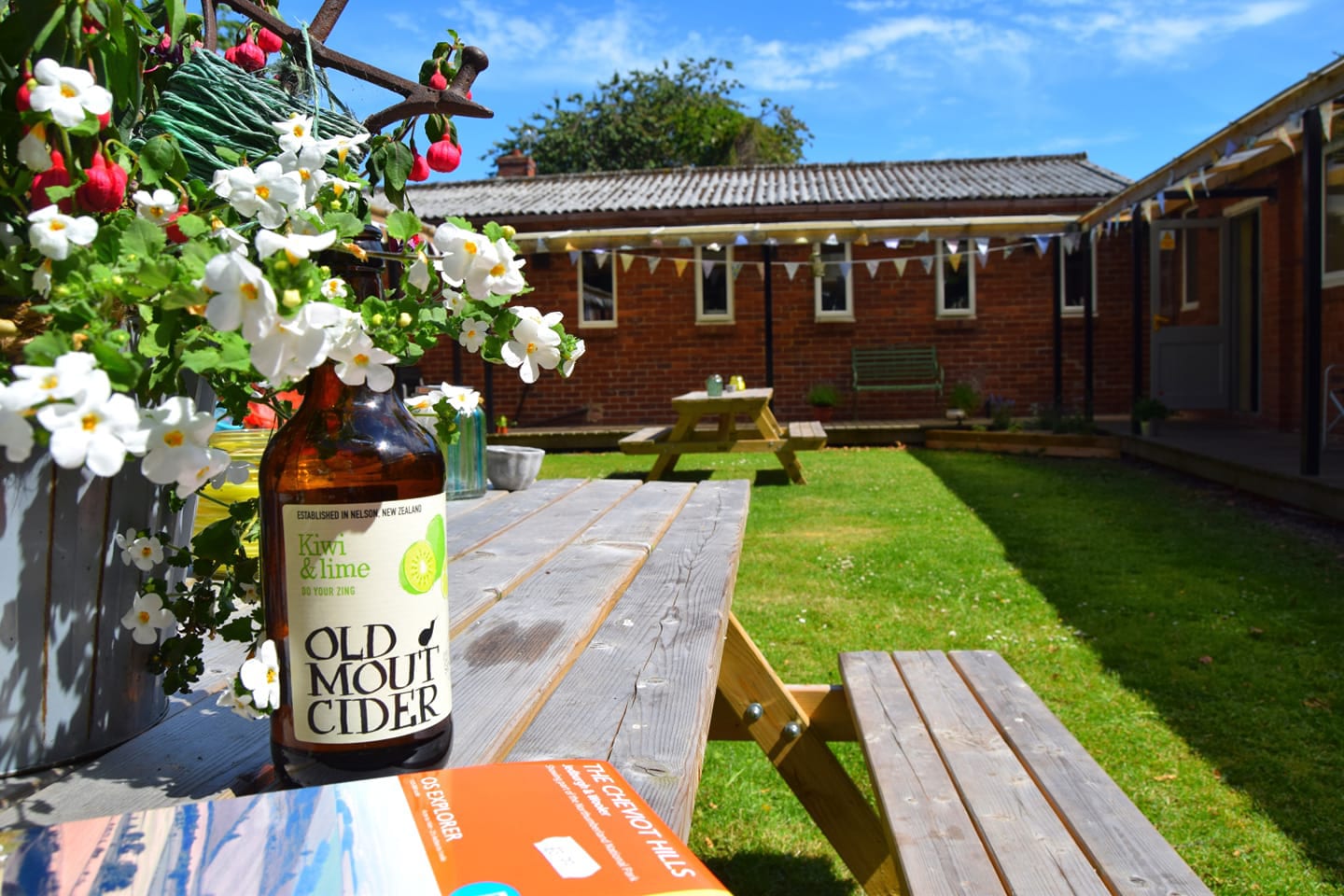 Cider on a bench in the sun