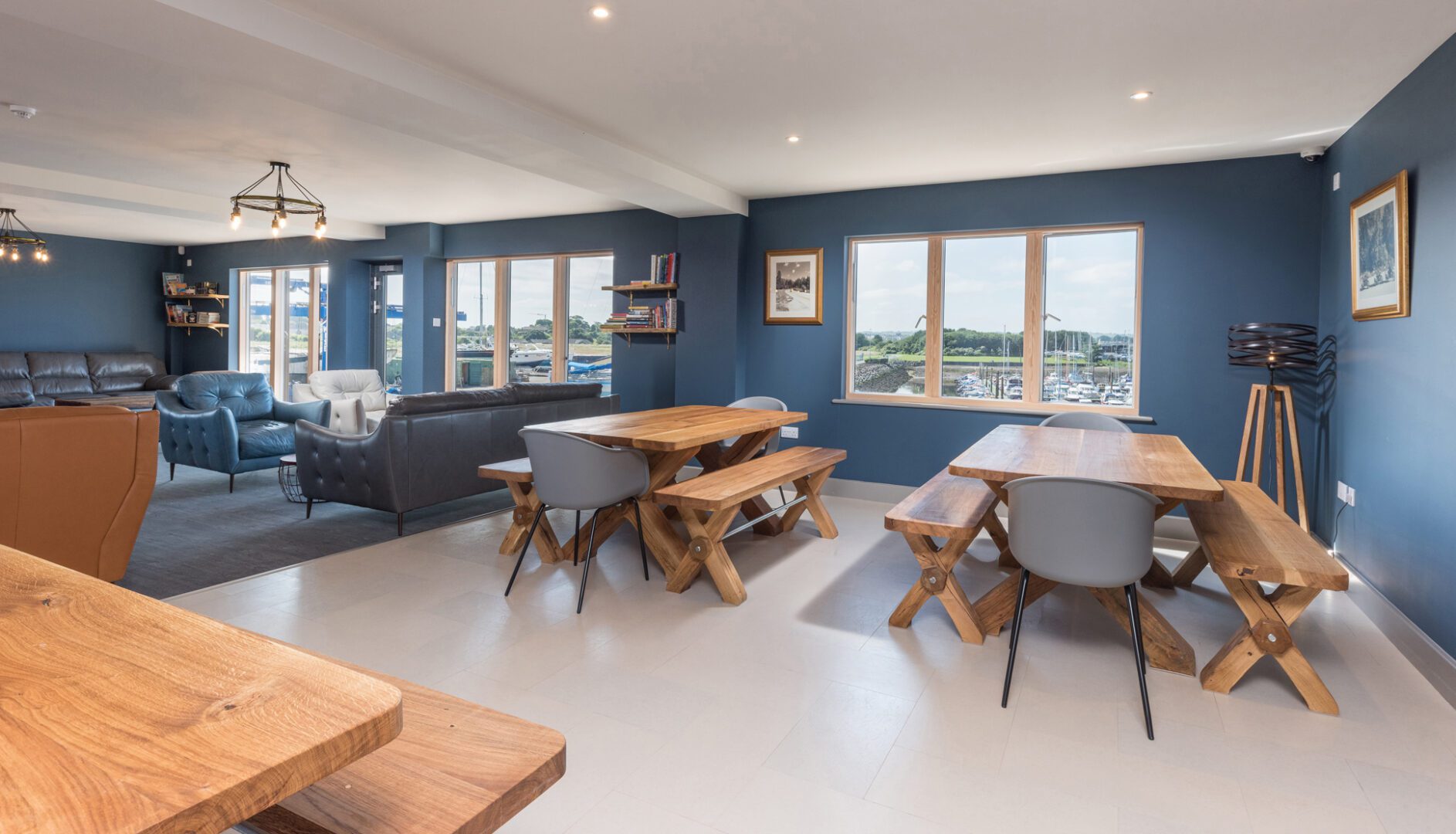 lounge with tables at Radcliffes Lodge Boutique hostel on the Northumberland coast