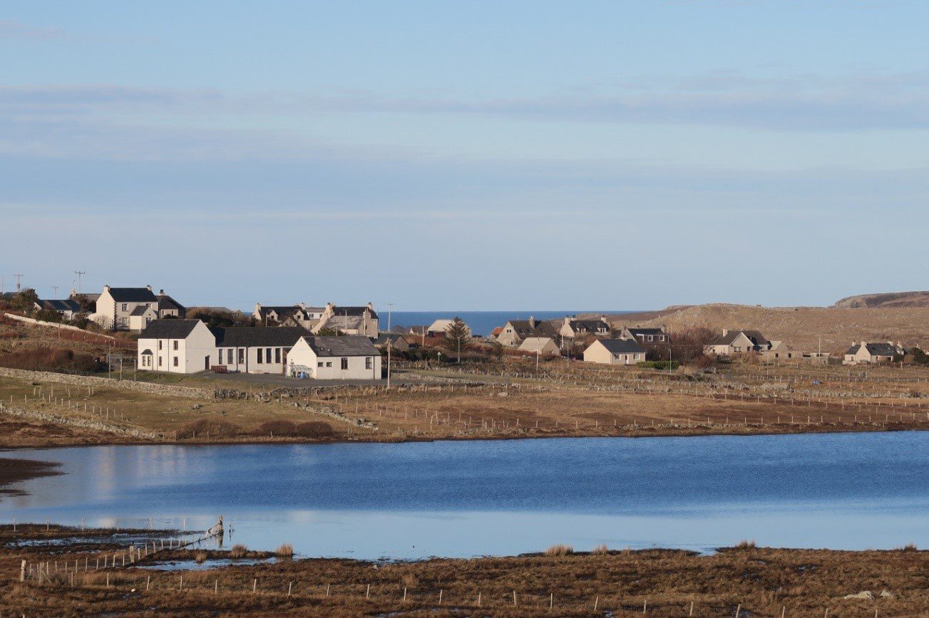 landscape scene showing Grinneabhat Hostel and surrounding crofts on the Isle of Lewis