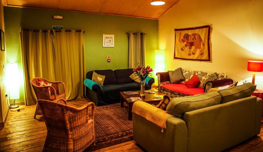 sofas in the cosy lounge at Naturebase hostel style accommodation on the West Coast of Wales