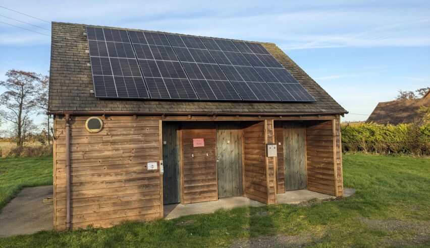 the farm hostel with solar panels on the roof