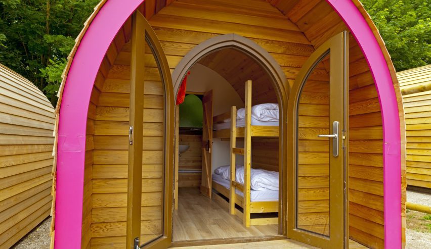 Looking through the door into the wooden arched glamping pod