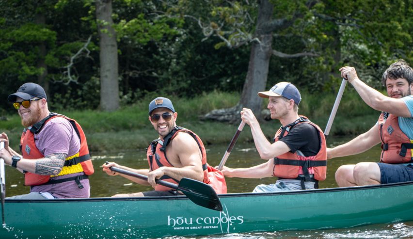 4 smiling canoeists