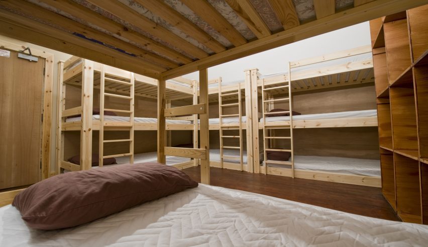 Dorm with triple wooden bunks