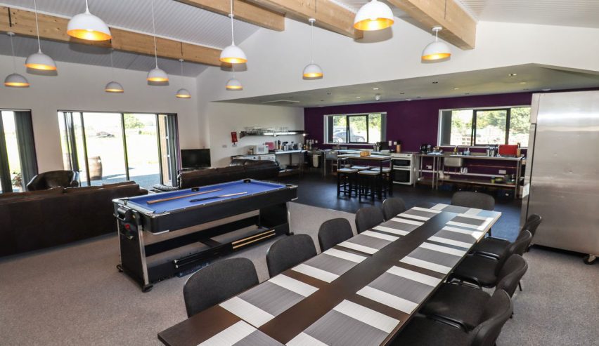 openplan kitchen dining area with pool table
