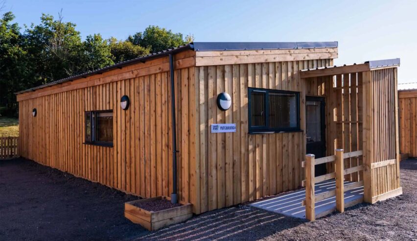 outside view of a lodge at Calvert Devon Lodges showing a wooden cabin structure