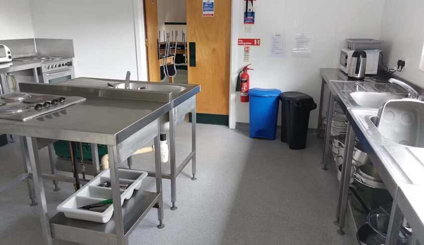 self caterin kitchen and view of dining room at Kintail Bunkhouse Outdoor Centre