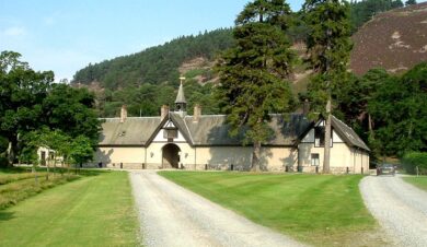 Mar Lodge Bunkhouse exterior veiw showing the hillside behing and bell tower