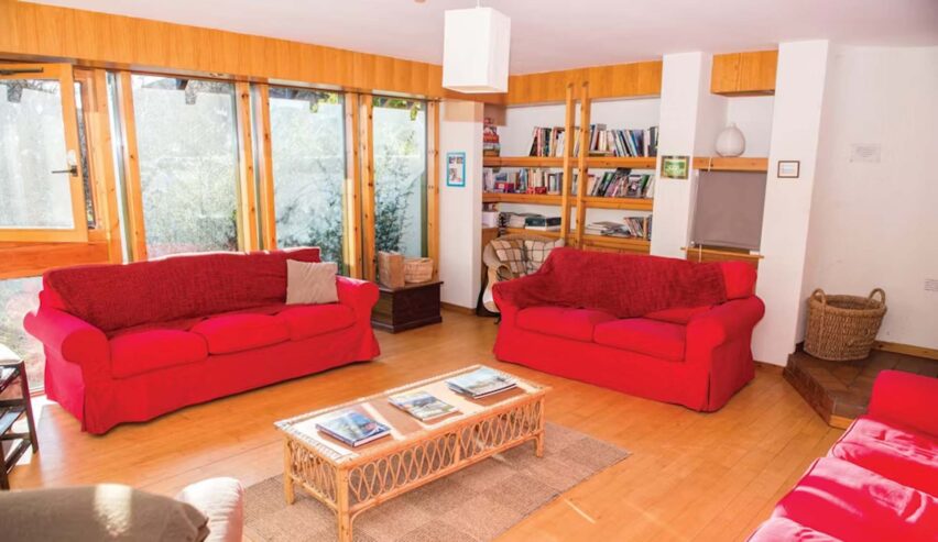 bookshelves and comfy sofas at Ben Lomond Bunkhouse