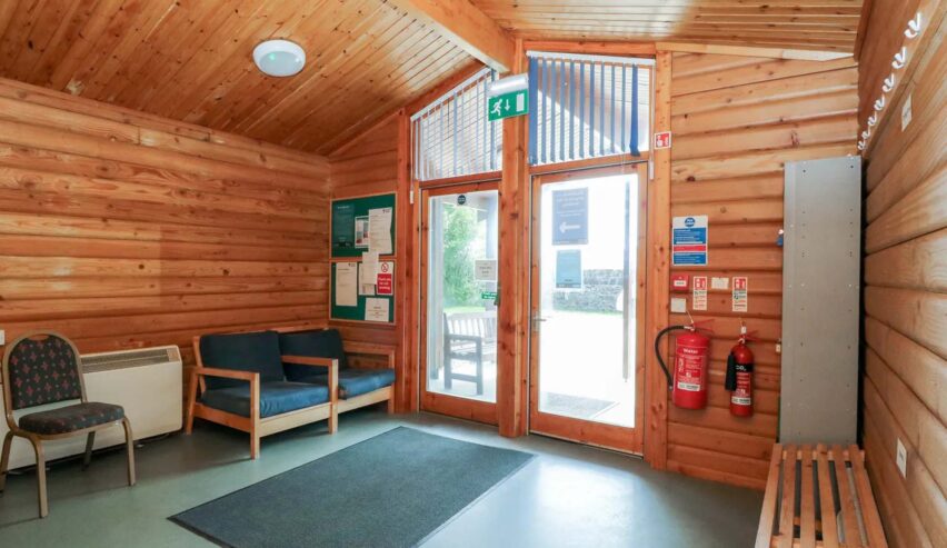 foyer with book racka nd benches at Shore Lodge Arran National Trust for Scotland Bunkhouse