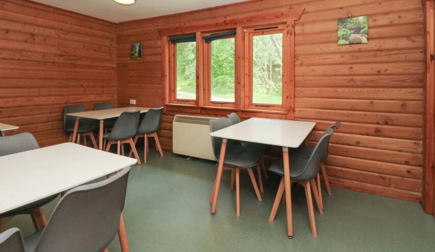 dining rooms with four tables each with four chairs around them